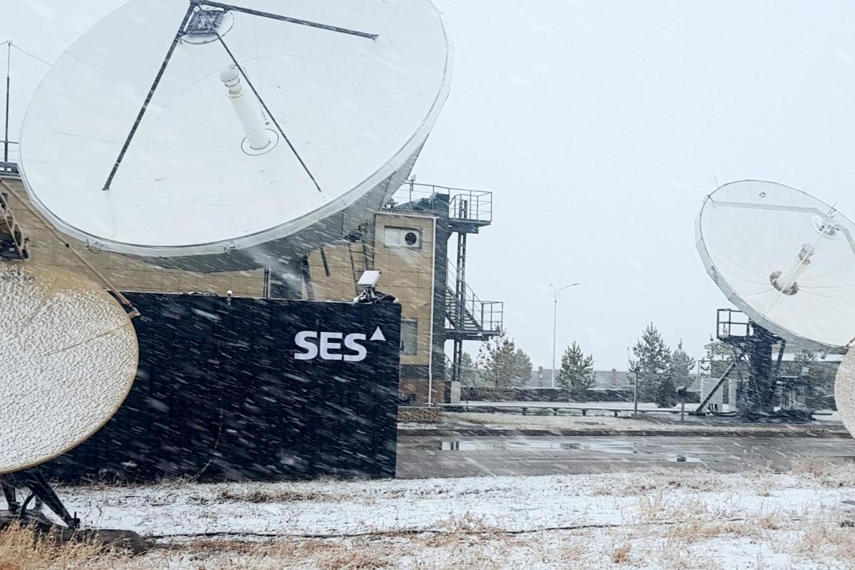 Image of satellite dishes at an SES facility during a snowfall.