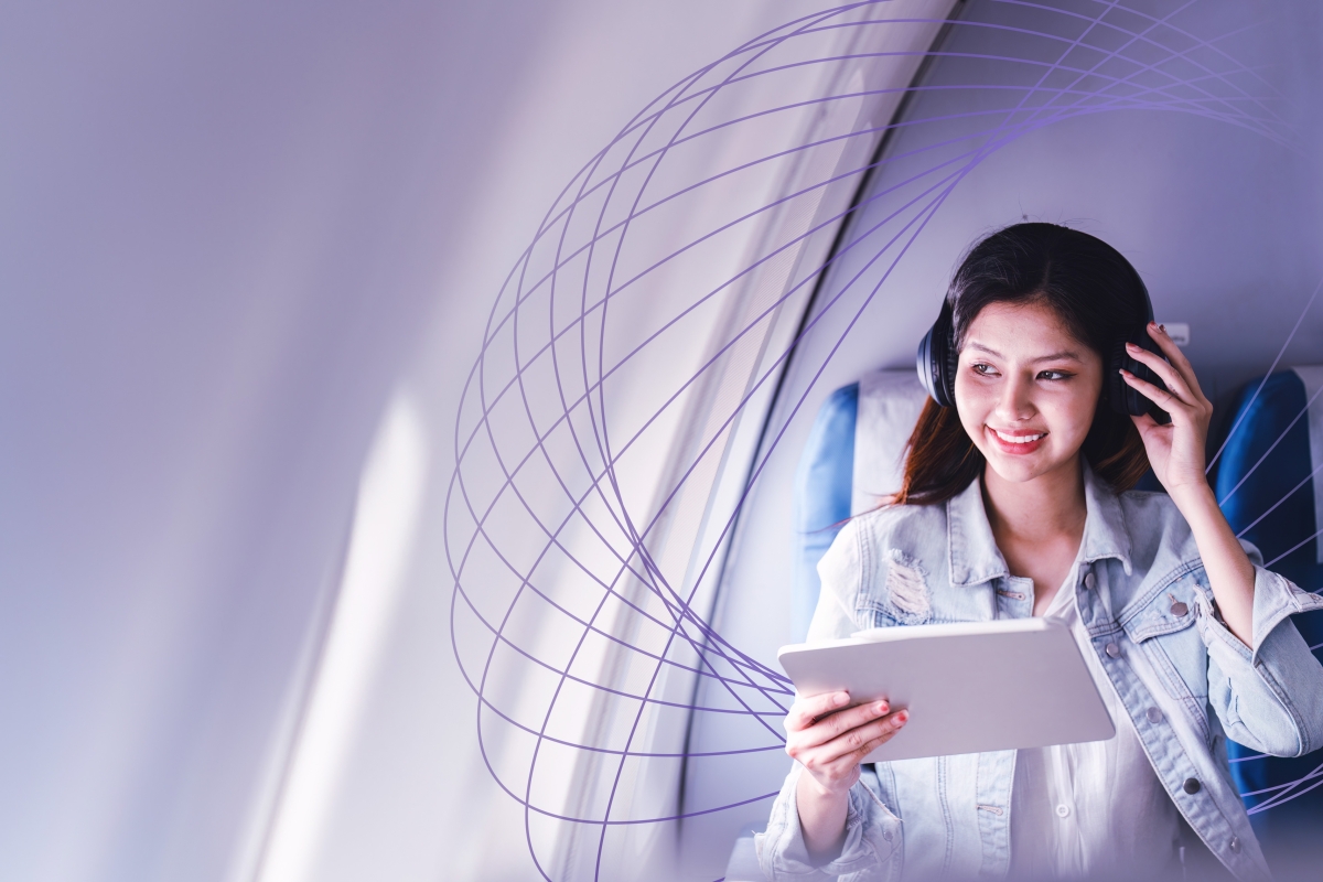woman with headphones on airplane
