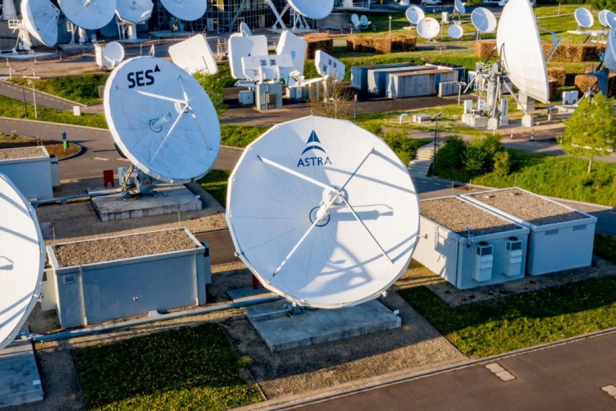 Image of antenna dishes in a field.
