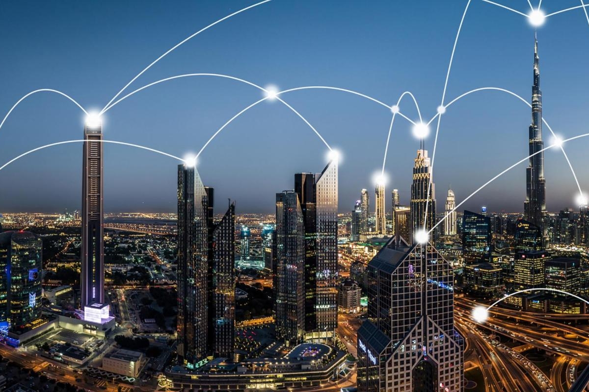 Image of city skyline at dusk with glowing network lines connecting across skyscrapers.