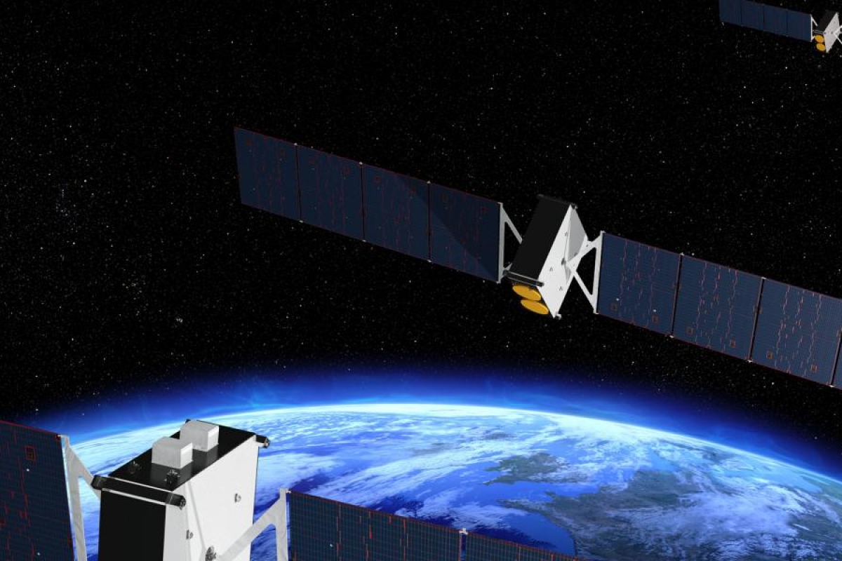 Image of satellites orbiting above Earth with solar panels extended.