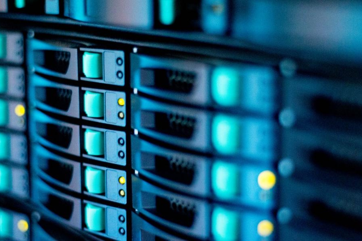 Close-up image of server hardware with illuminated indicator lights.