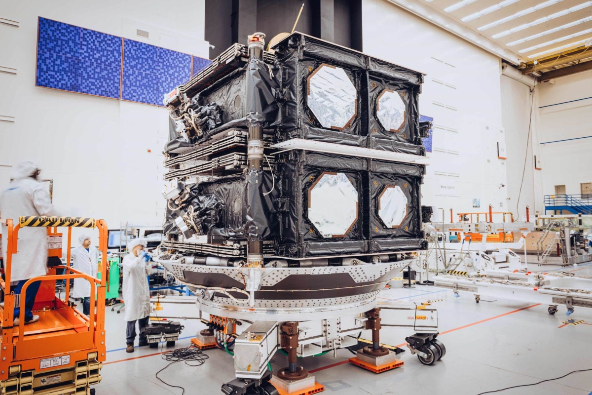 Two satellites in a stacked configuration getting ready for delivery