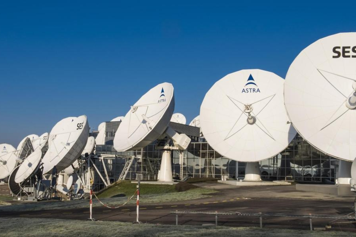 Image of SES and Astra satellite dishes outside a facility.