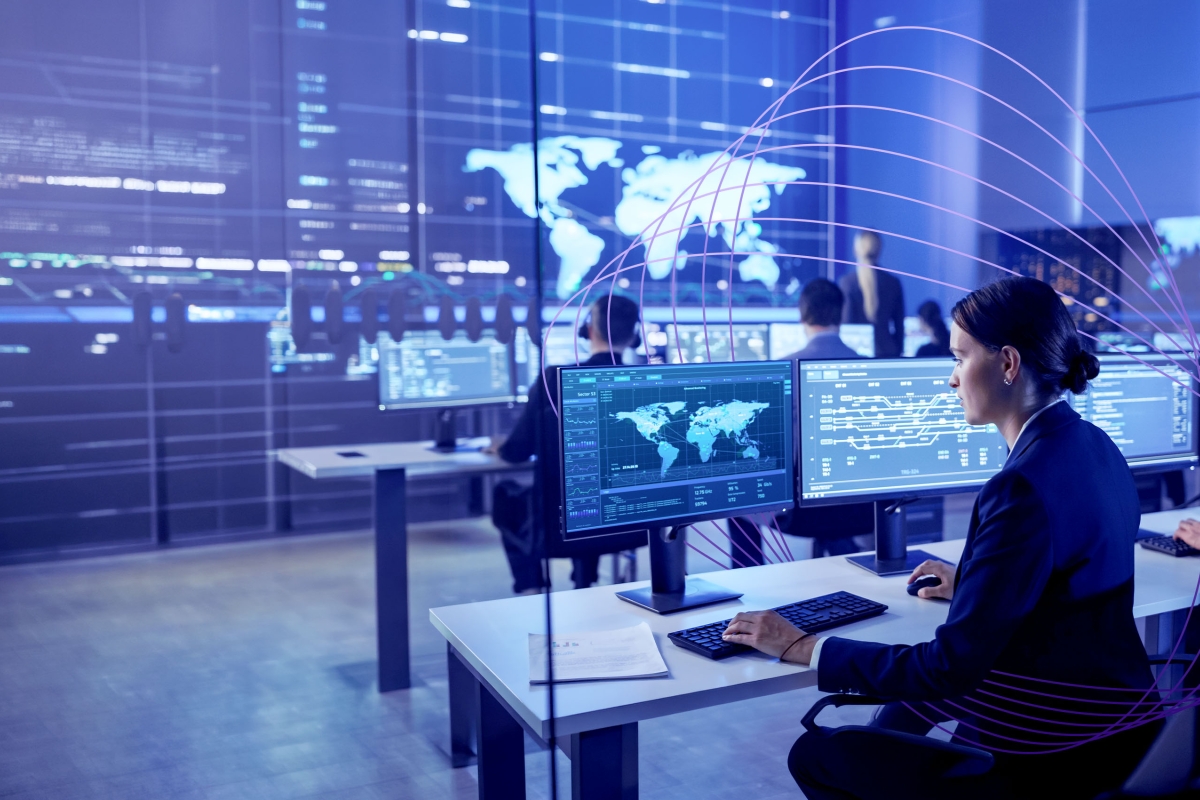 woman observing multiple screens