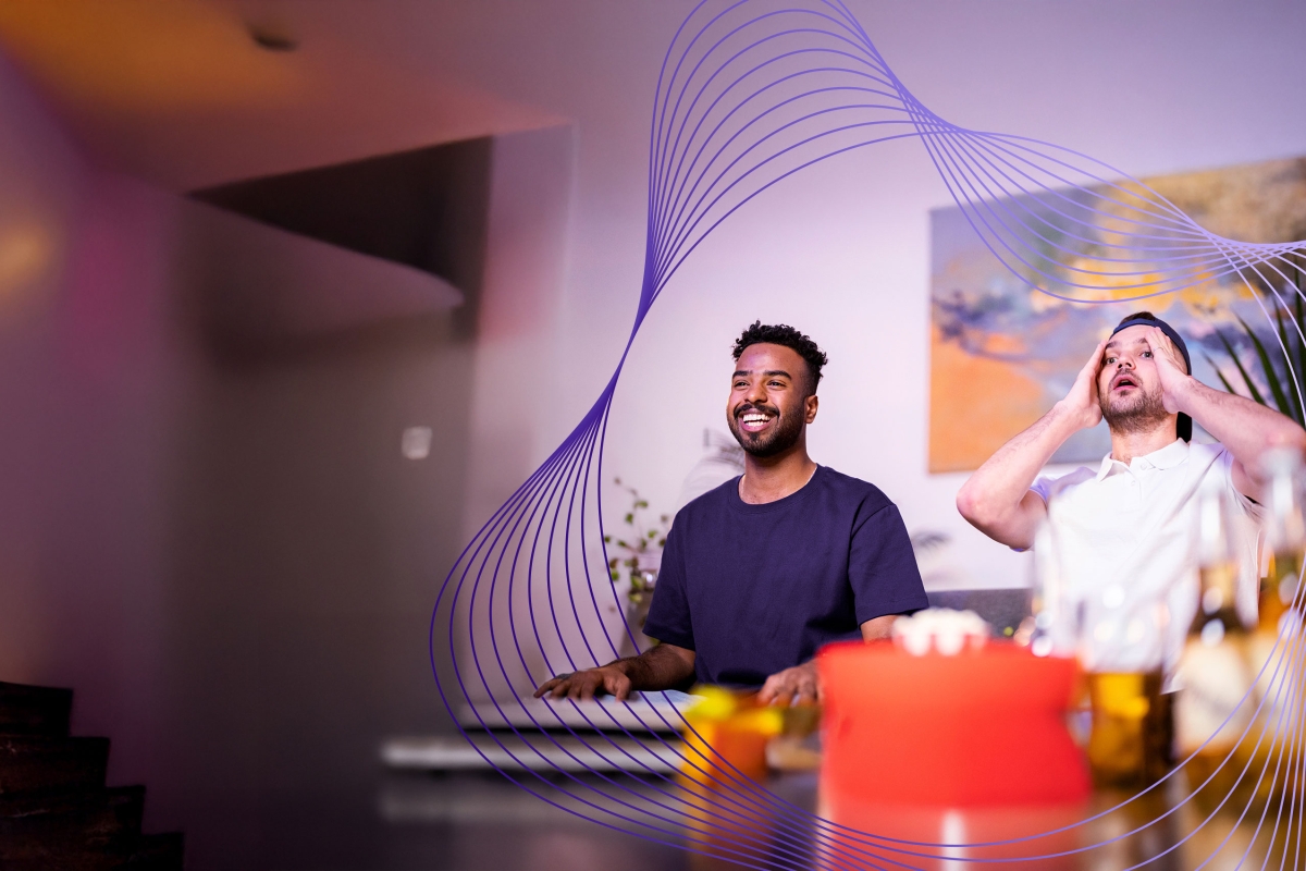 two men watching sports on television
