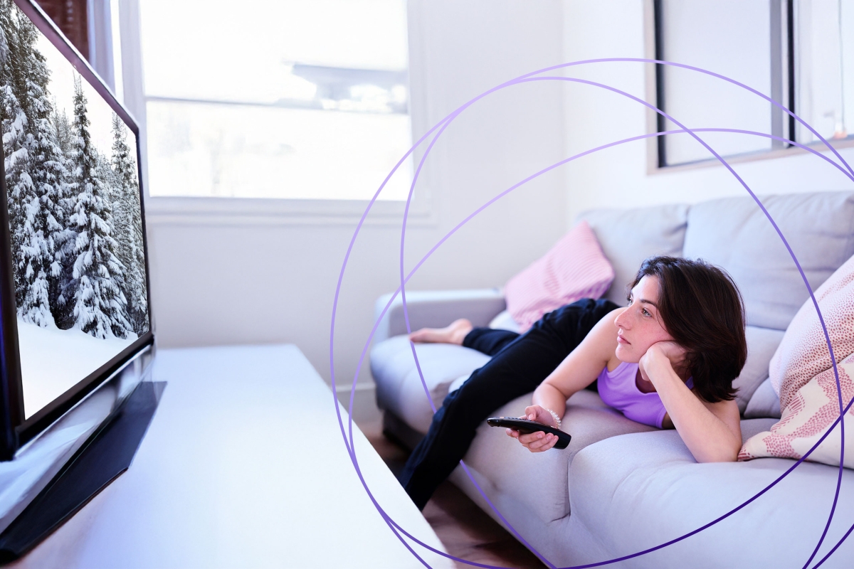 woman with tv remote control