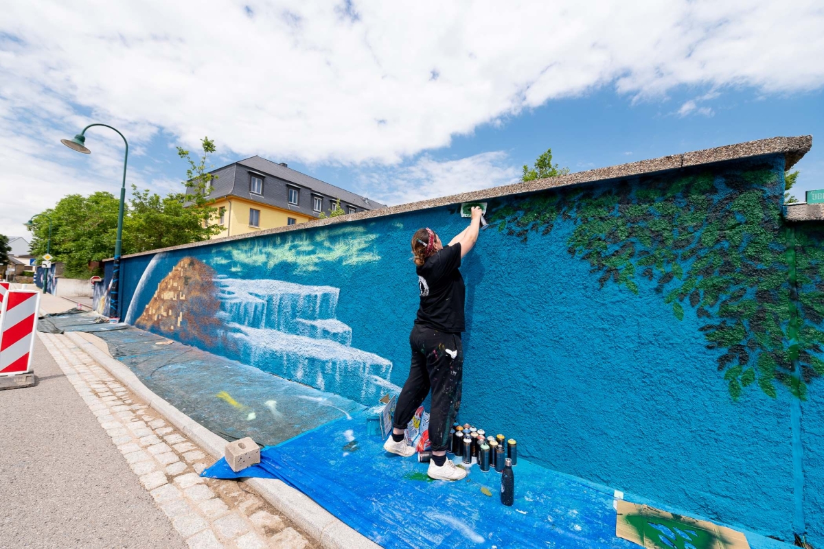 painting tree leafs on mural art