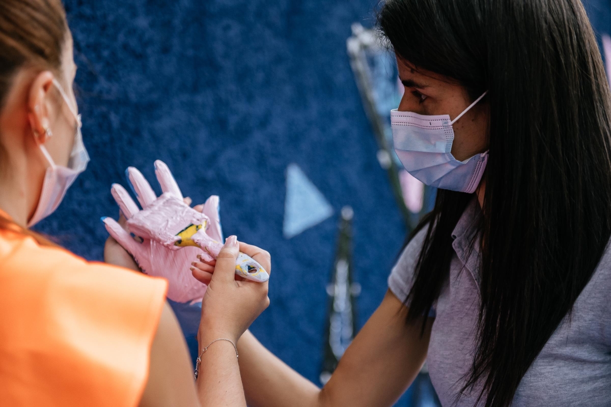 person painting hand