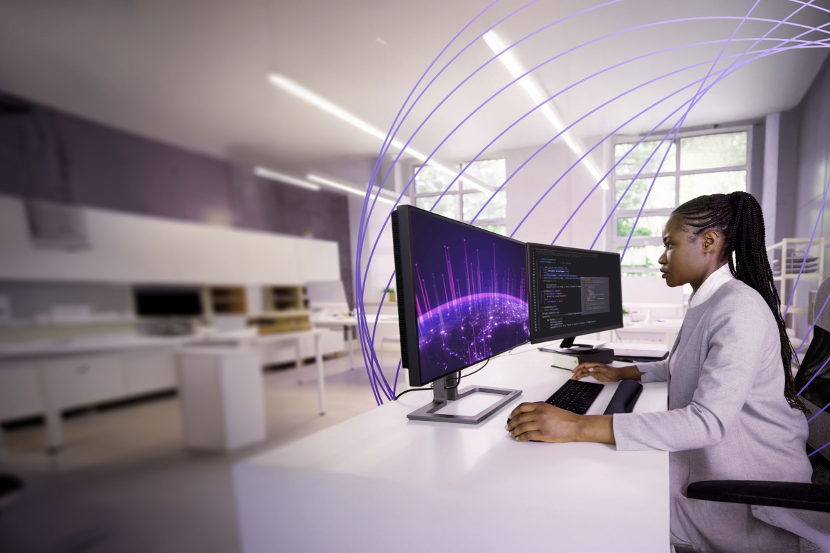 Woman monitoring computer screens