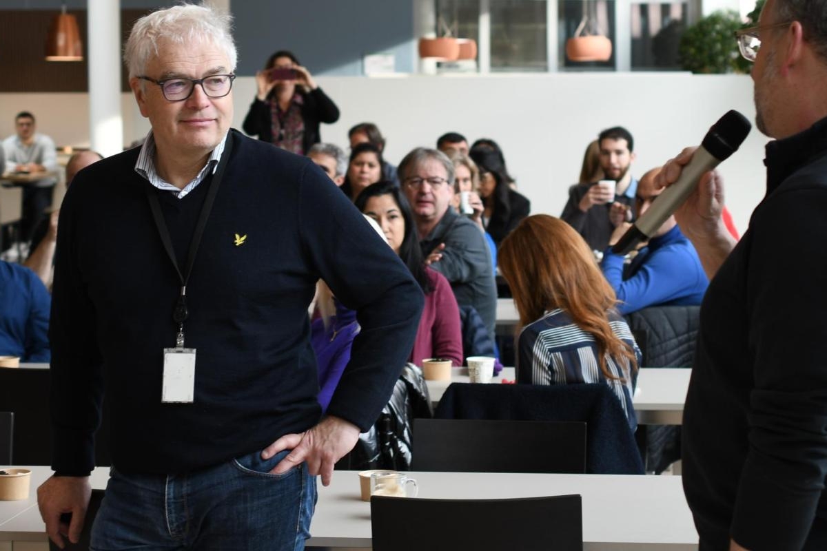 Image of John Baughn in a room with other people