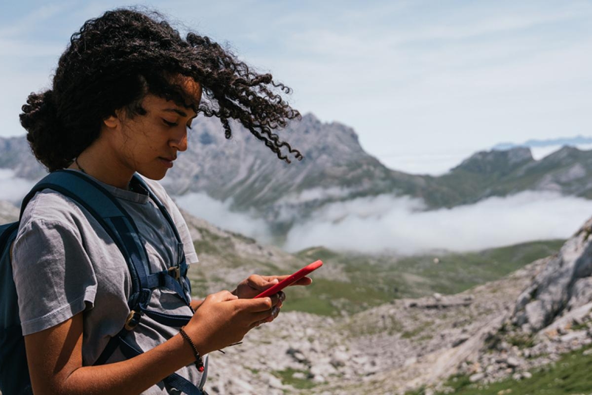 woman in the mountains using a phone