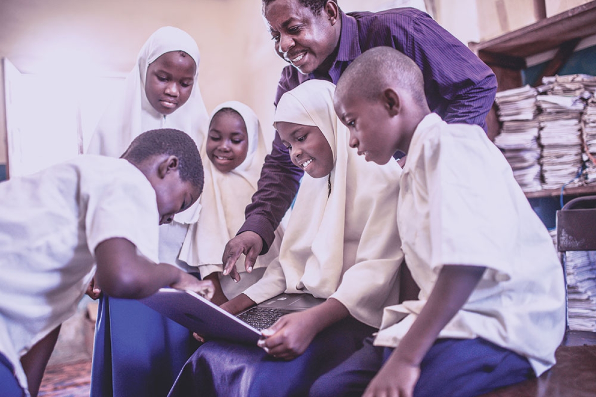 Teacher with students in African country