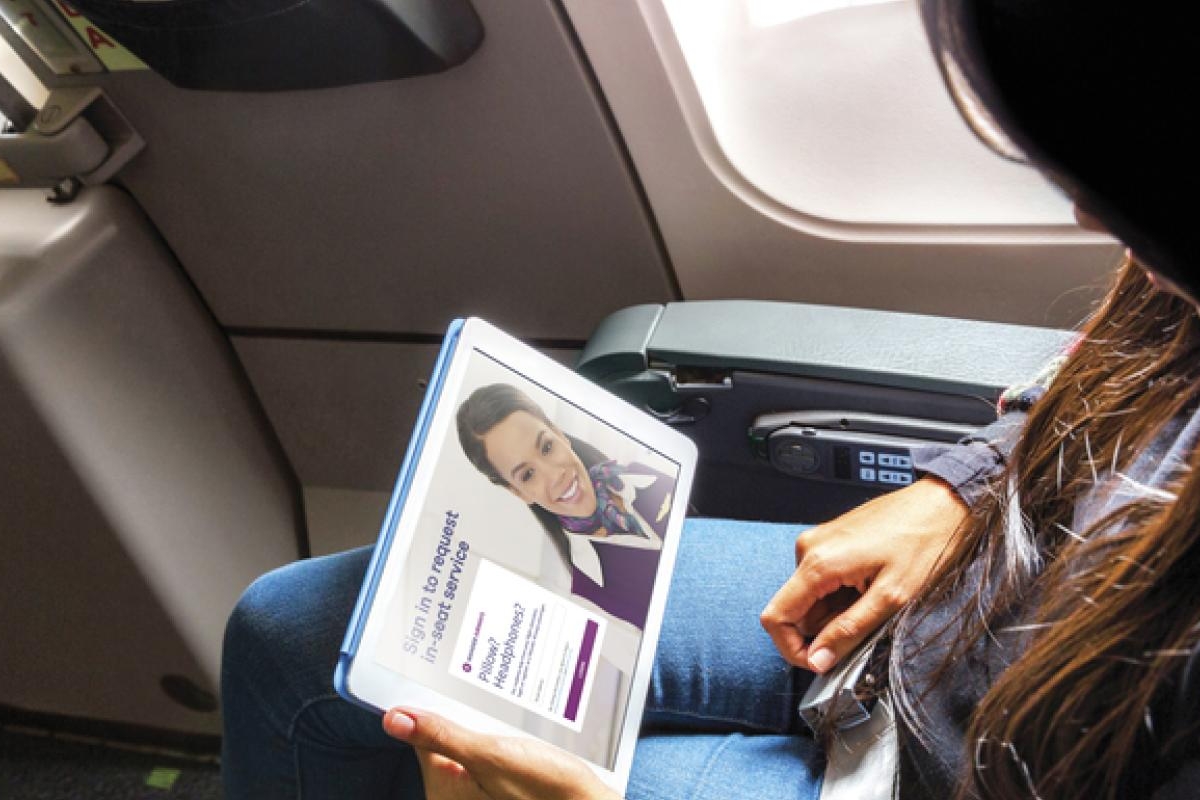 Airline passenger watching video on tablet