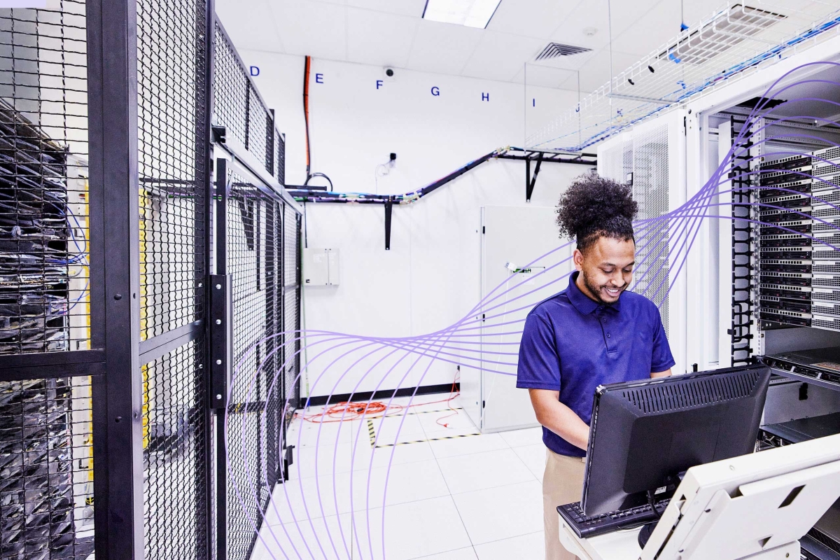 man working in server room