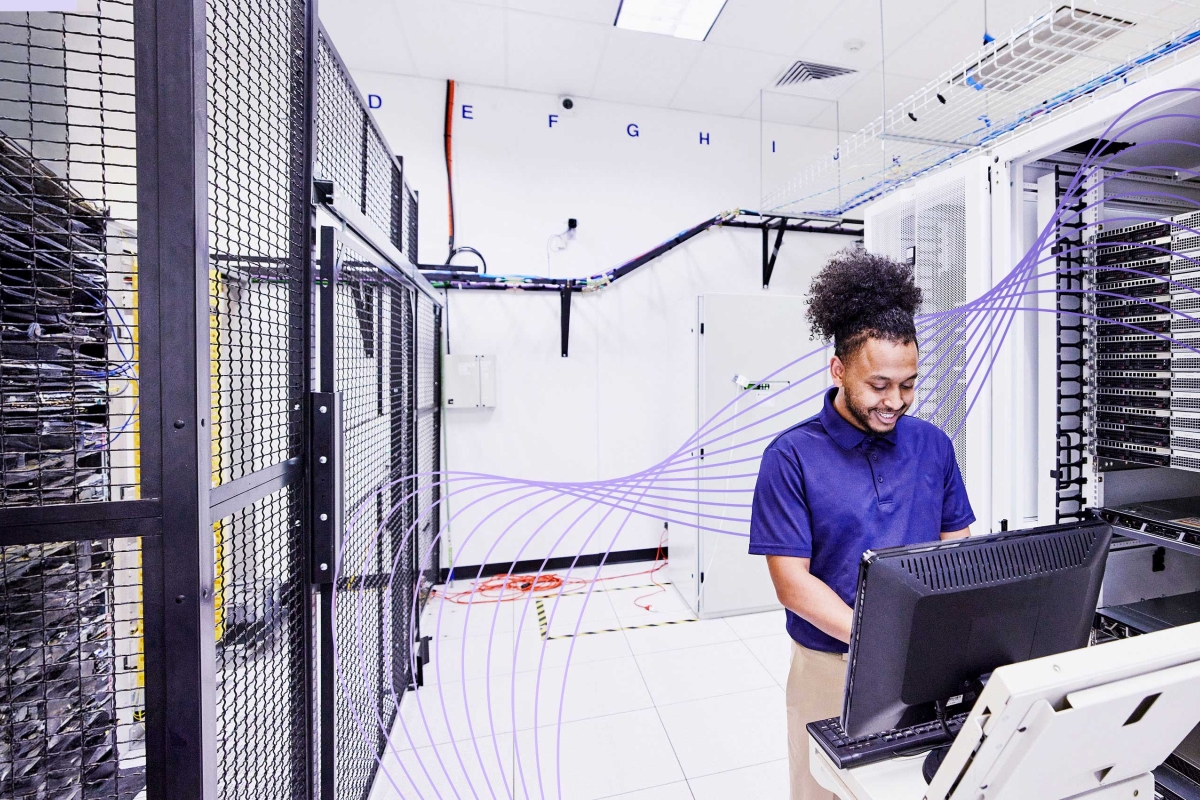man working in server room