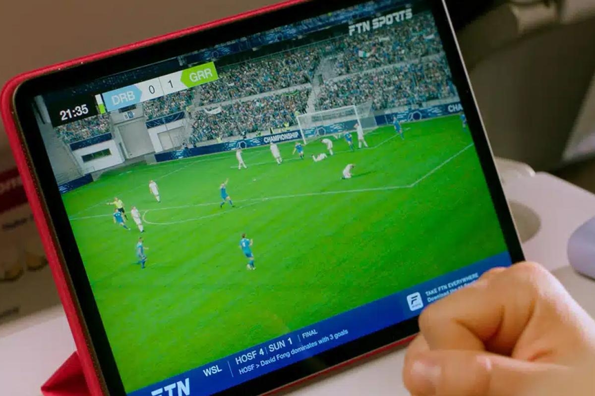 passenger watching sports on a tablet