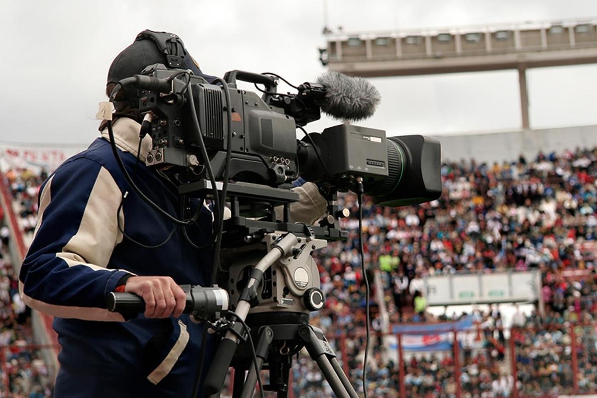 Image of a Videographer shooting in a stadium