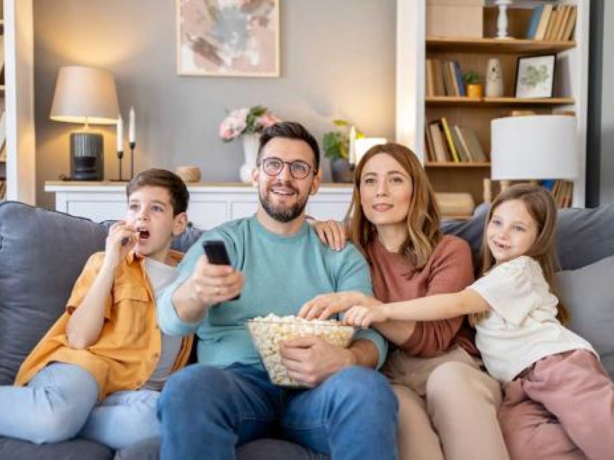 Watching TV and eating popcorn