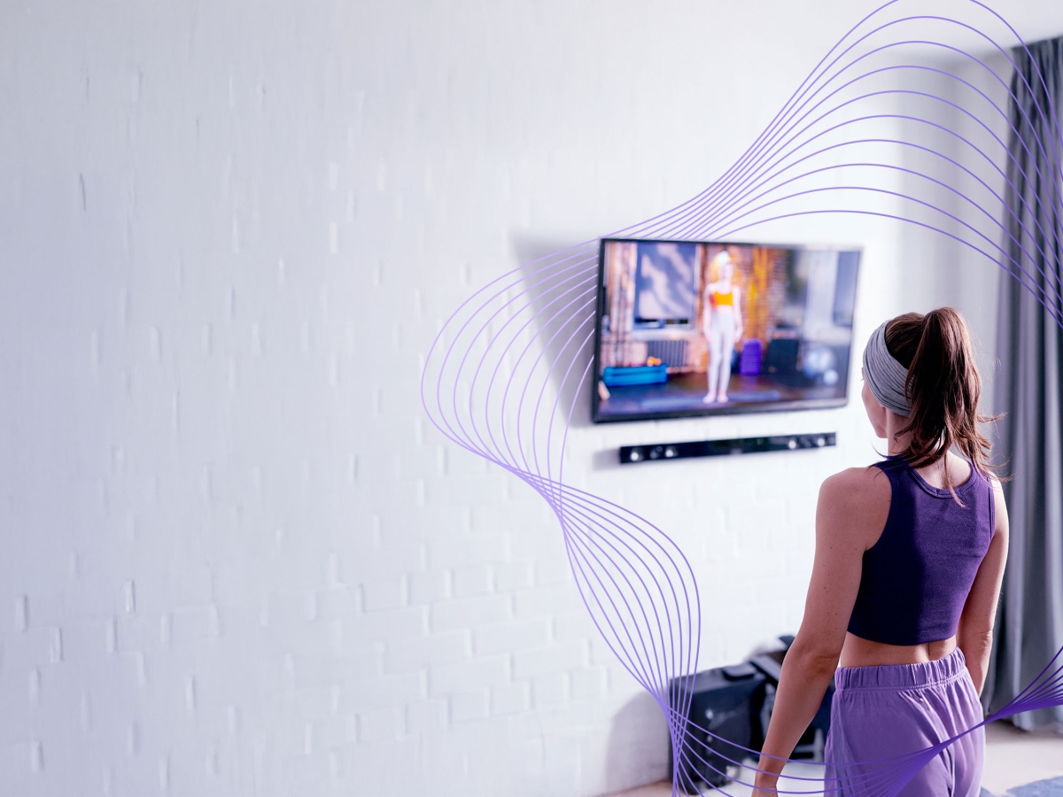 woman exercising and watching tv