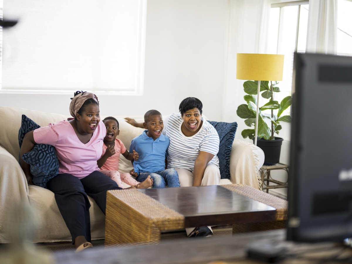 Family cheering TV