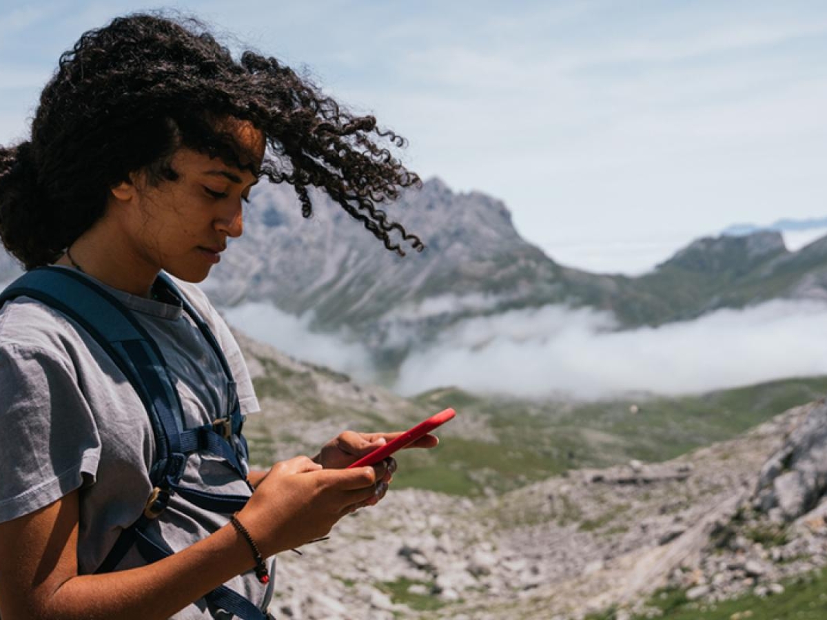 woman in the mountains using a phone