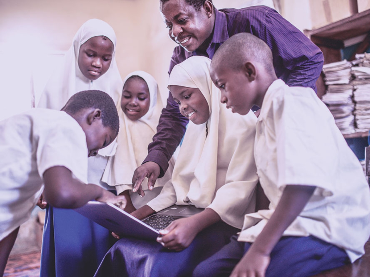 Teacher with students in African country