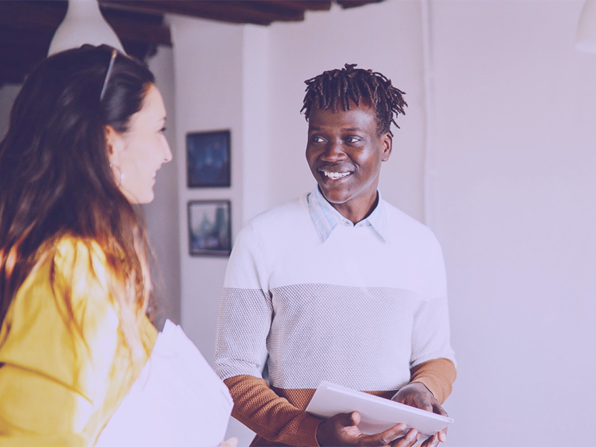 Two young employees talking