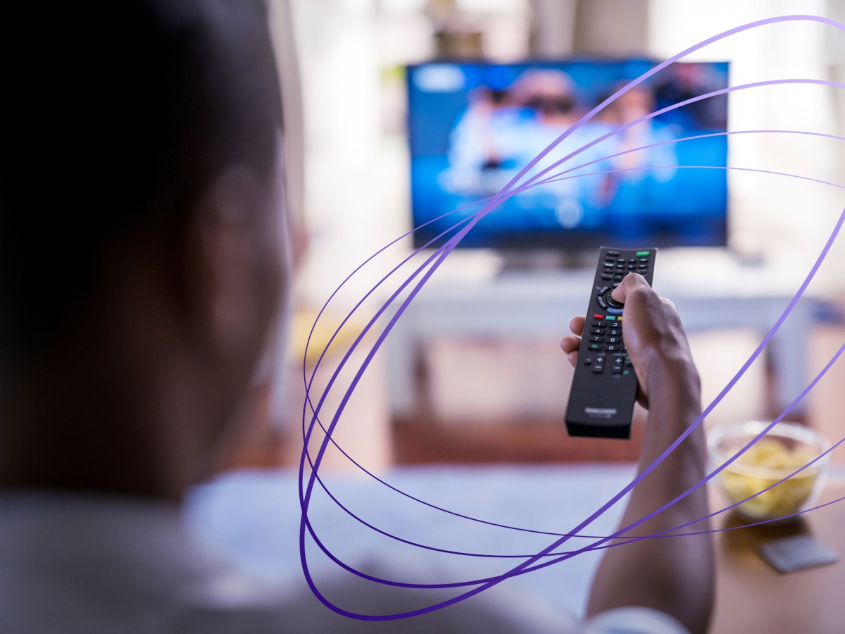 man using tv remote