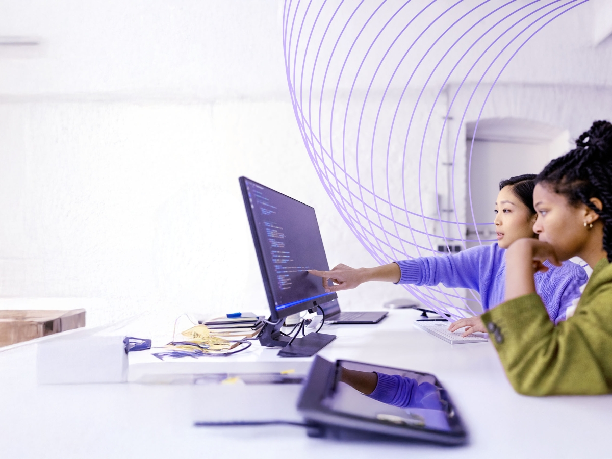 young women using a touchscreen computer