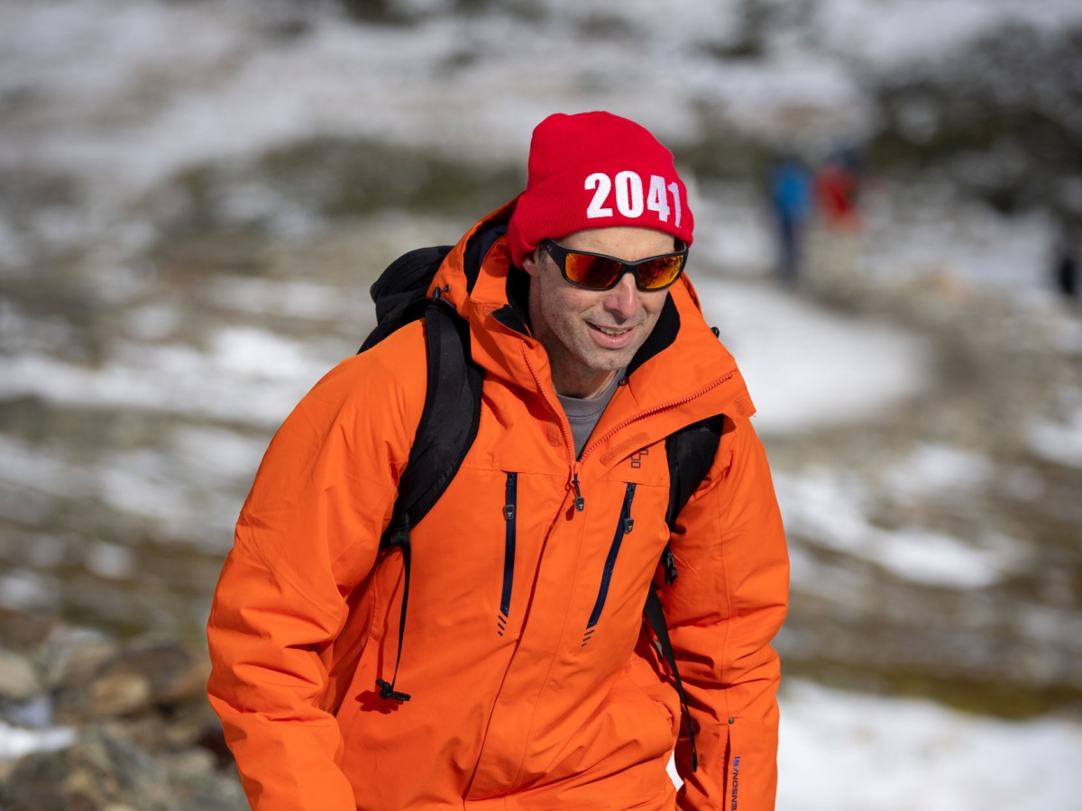 Image of a person walking in ice covered path in Antarctica