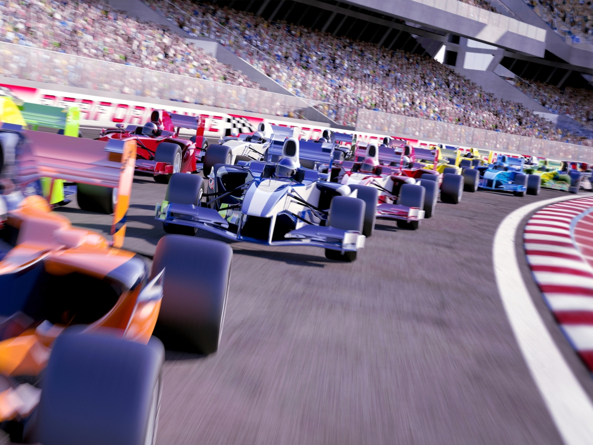Image of race cars behind one another on track.